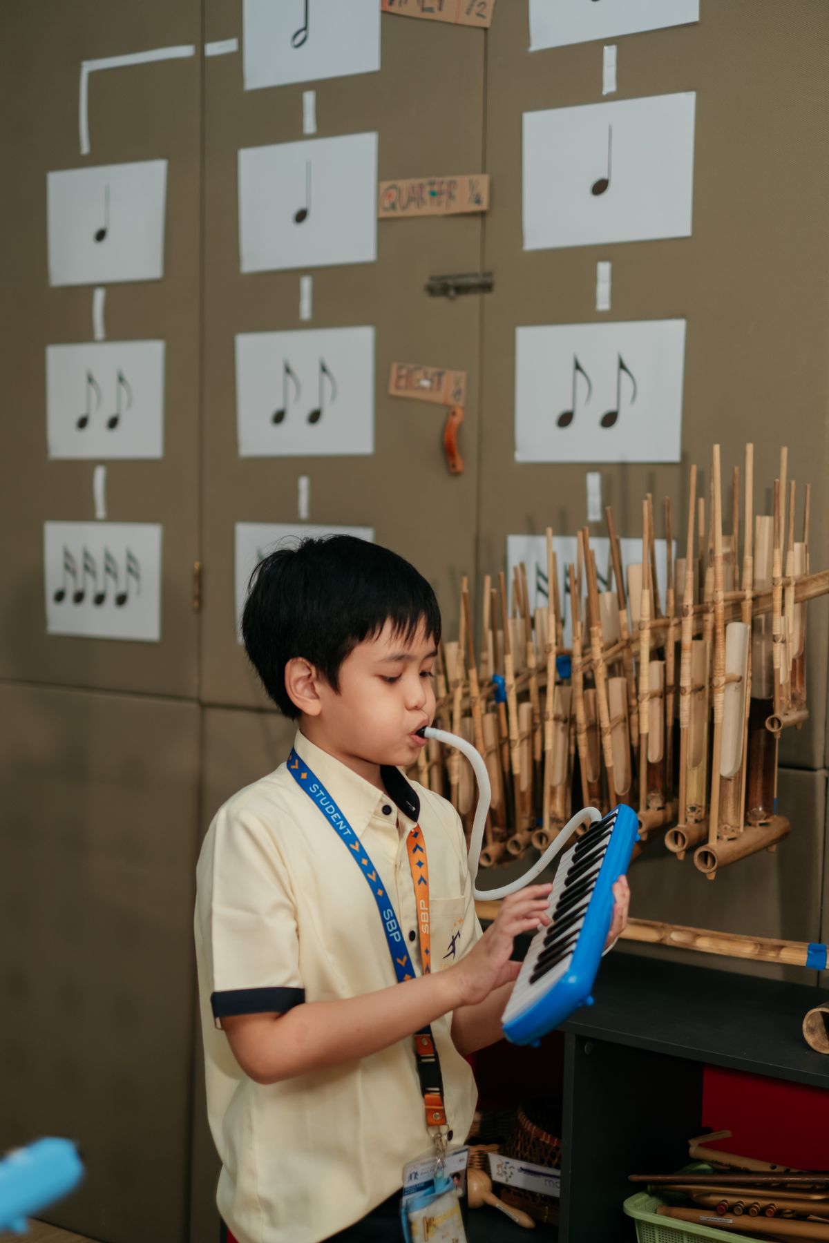 A student playing the angklung