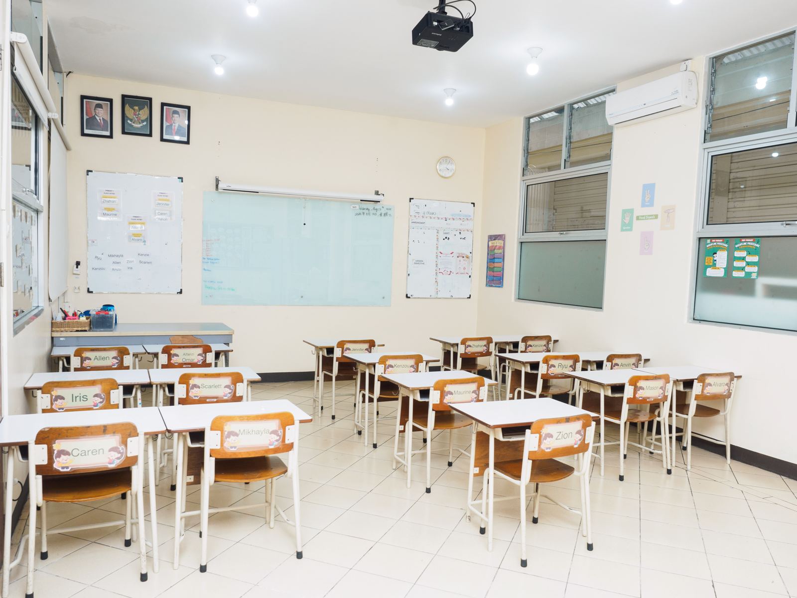 A bright Primary classroom with desks in groups