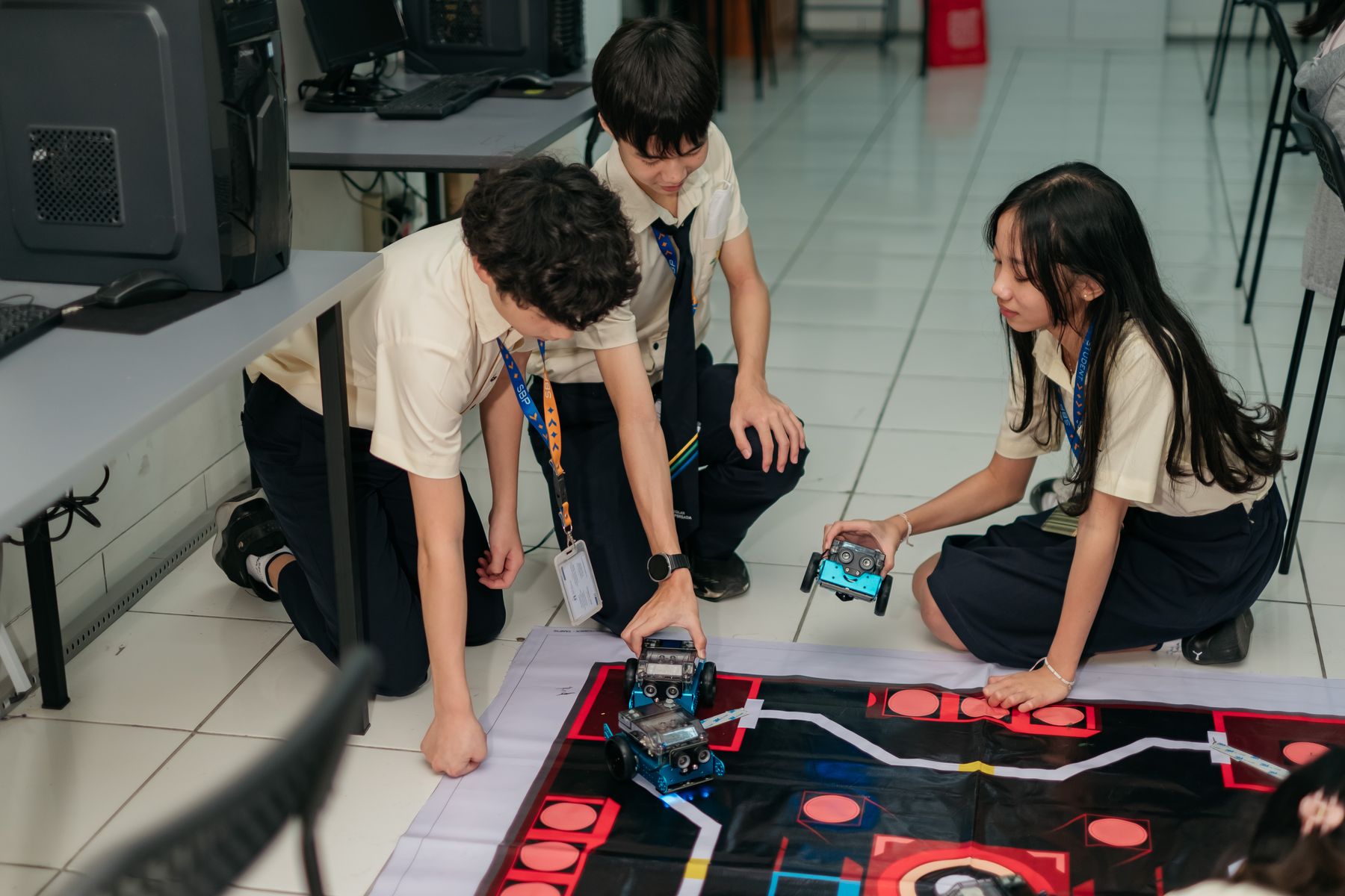 Students testing a small robot